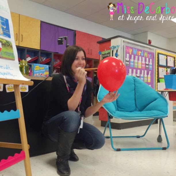 cause-and-effectballoon teacher squatting down holding a pin to a balloon for a cause and effect activity