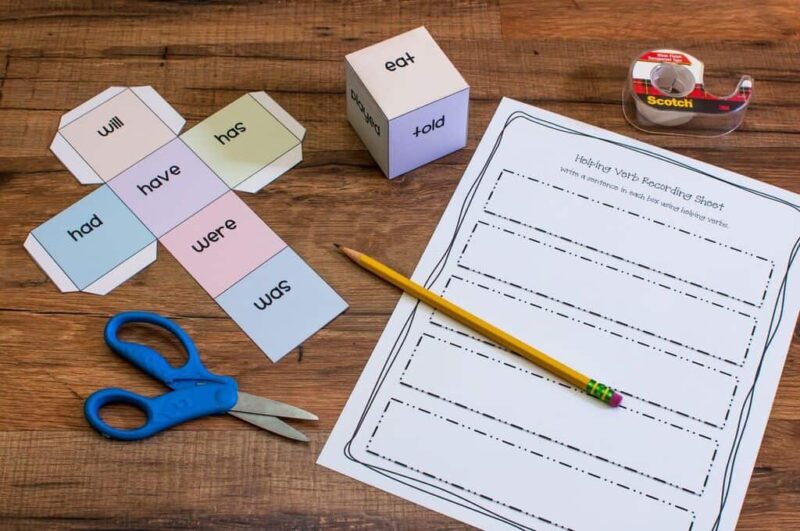 dice with verb tenses on it for verb tense activity 