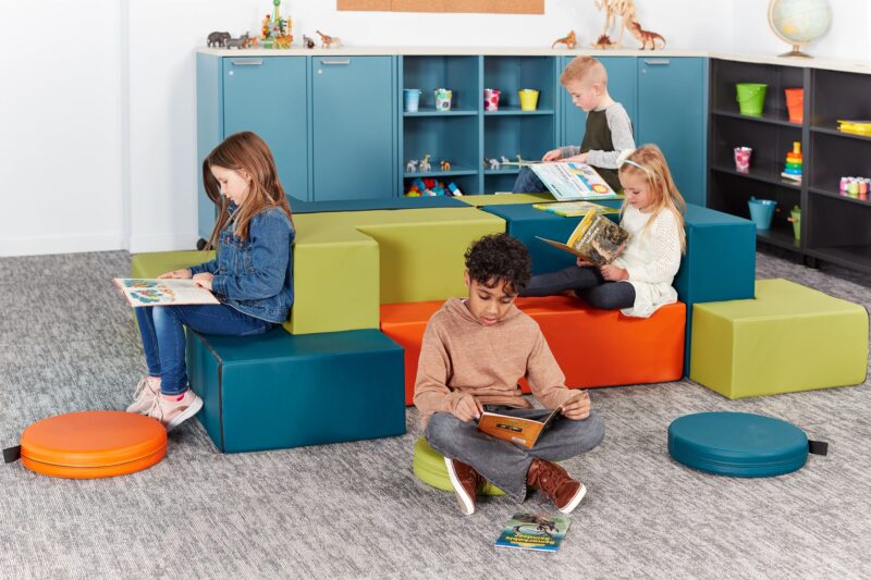 Imaginasium Blocks & Blips students in classroom sitting and reading