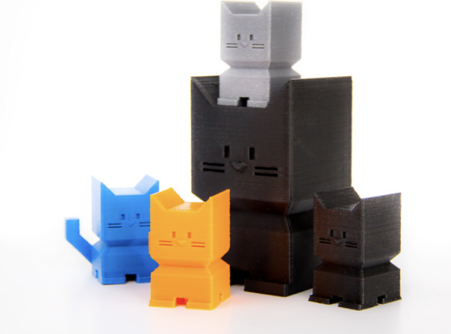 Different colored 3d printed cats as an example of 3D printing ideas